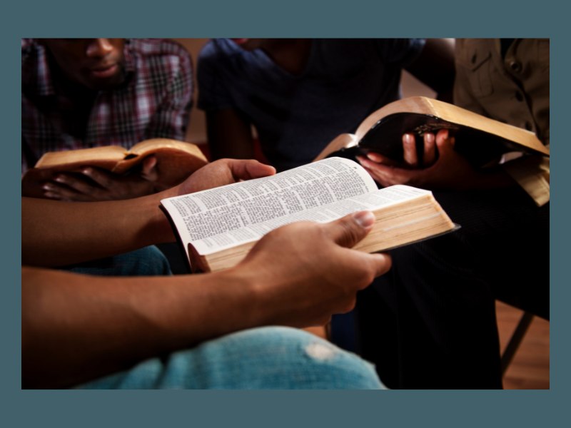 Young people reading the Bible 
